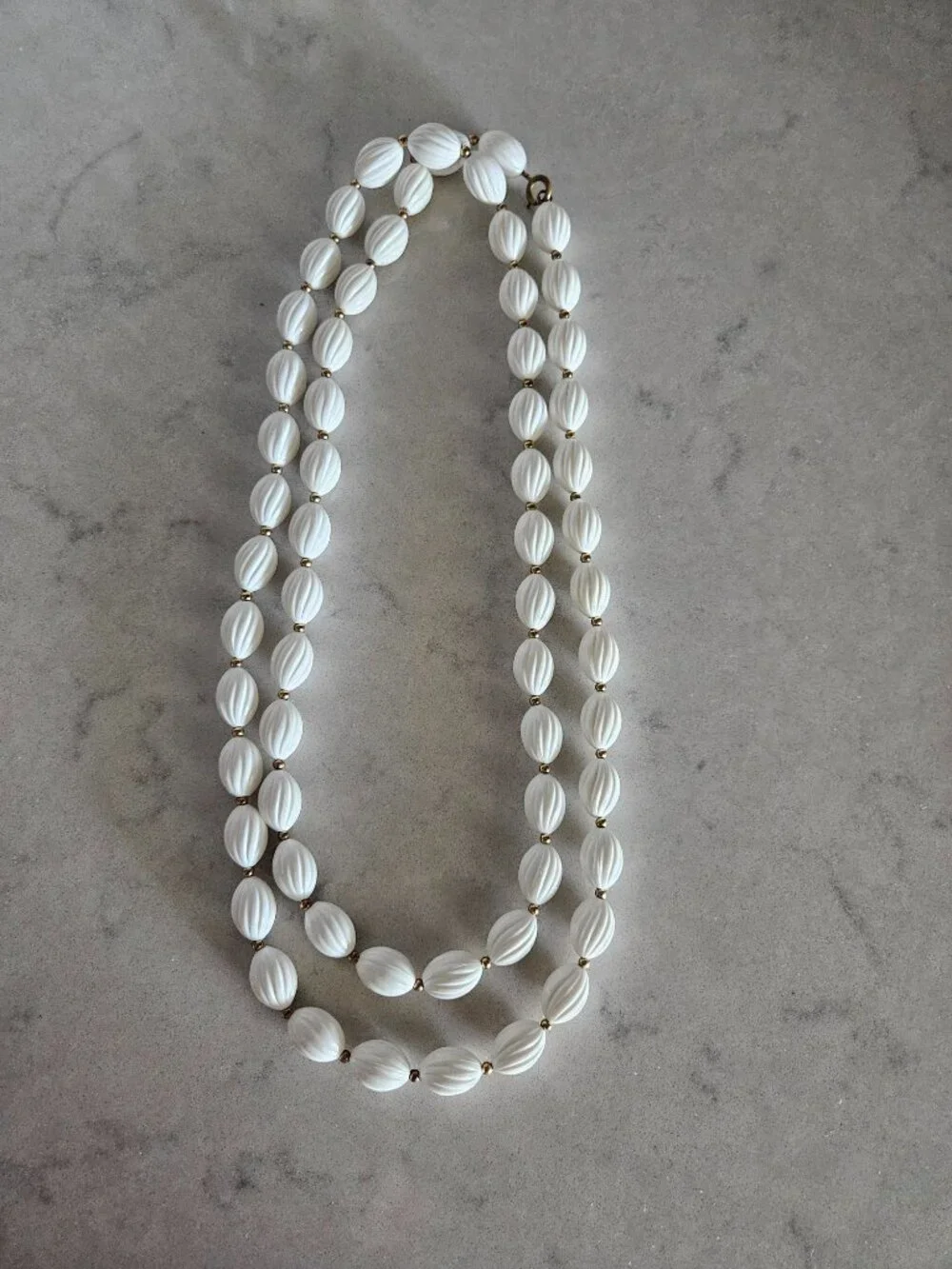 RARE AND VINTAGE WHITE RIBBED OVAL BEAD 48